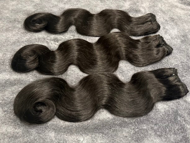 Three bundles of Human hair in body wavy