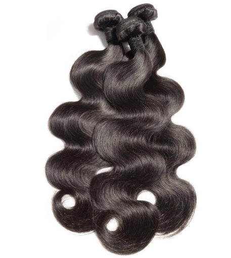 Three bundles of Brazilian body wavy human hair piled together