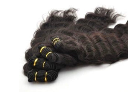 Bundles of wavy Human  hair extensions on a white background