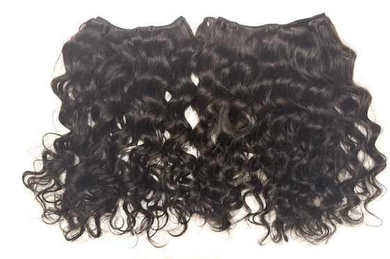 Two pieces of Brazilian loose  curly hair extensions on a white background