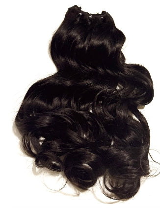 Black Brazilian natural wavy hair extensions on a white background