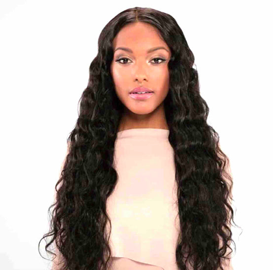 Beautiful afro Caribbean woman wearing Brazilian human wavy hair extensions